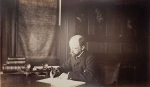 Henry_Adams_seated_at_desk_in_dark_coat,_writing,_photograph_by_Marian_Hooper_Adams,_1883